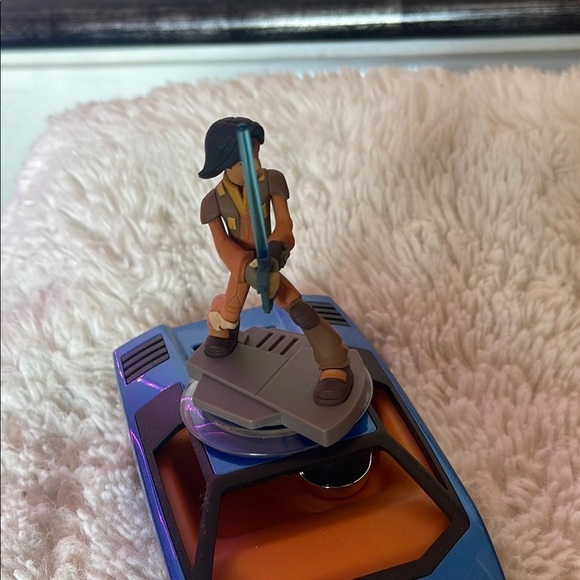 Action Figure with Blue Lightsaber on Vehicle - Picture 1 of 5